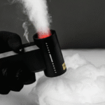 Holding a booster w05 leaf blower to blow mist