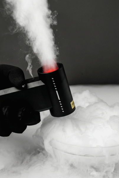 Holding a booster w05 leaf blower to blow mist